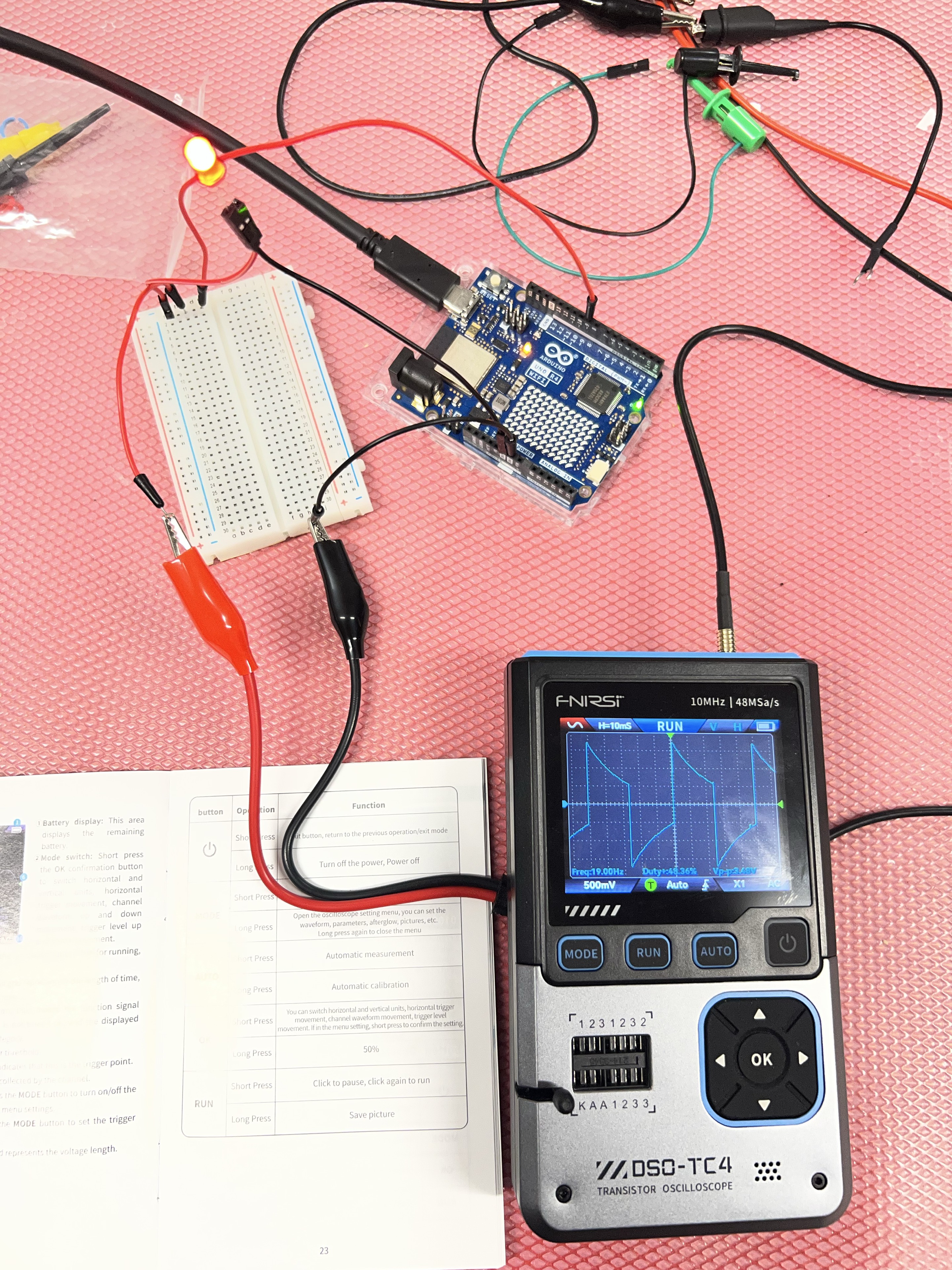 The DSO-TC4 showing a distorted waveform while probing the Arduino circuit